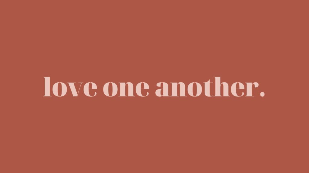 Love One Another in pink on rouge.
